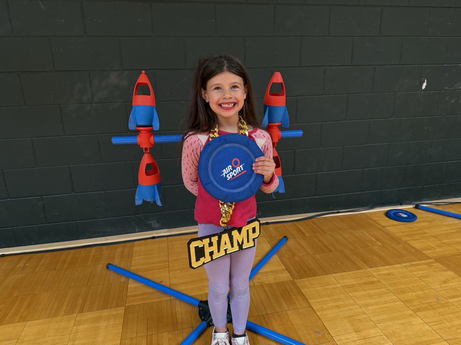 A young Air O Sport champion, disc in hand