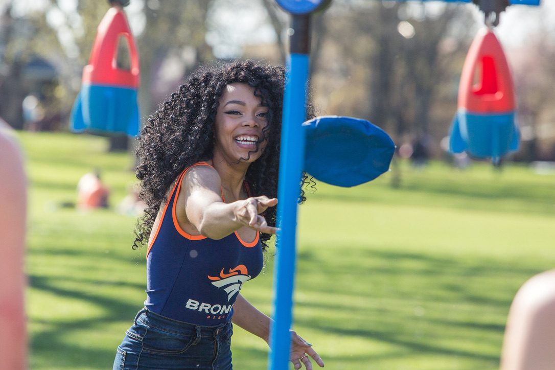 A player throwing a disc at the target