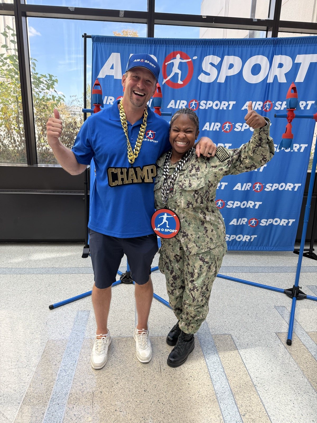 A U.S. Navy service member celebrating at Air O Sport